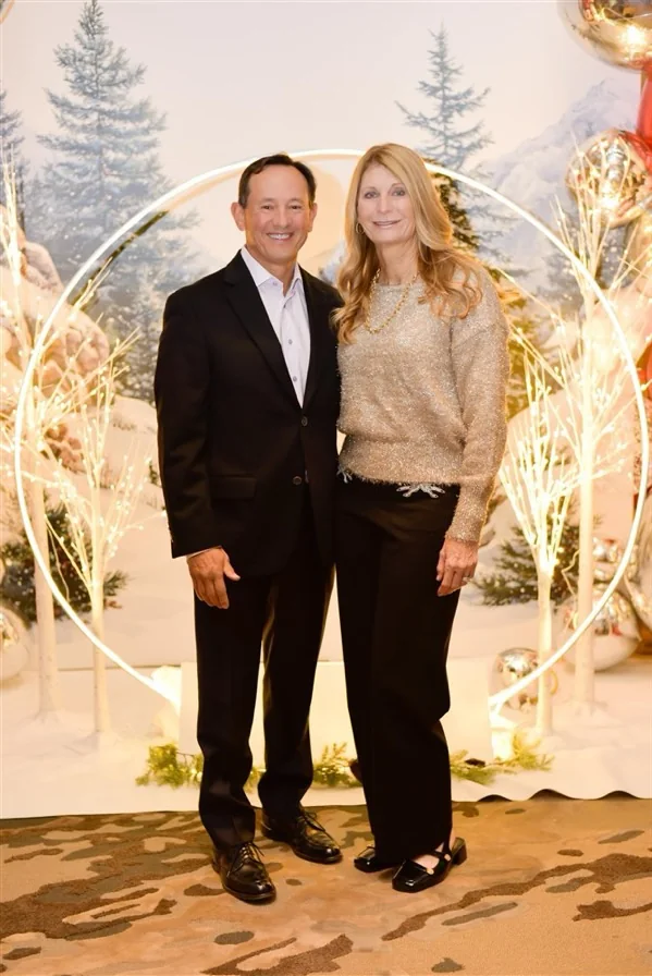 Robert and Katie Ruelas together at a winter celebration